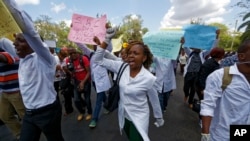 FILE - Kenyan nurses and other health-workers demonstrate over low pay at Uhuru Park in downtown Nairobi, Dec. 8, 2016. 
