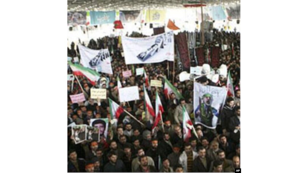 Iranians take part in the funeral of Sanee Zhaleh, a student who was shot dead during an opposition rally on in Tehran, February 16, 2011