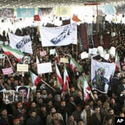 Iranians take part in the funeral of Sanee Zhaleh, a student who was shot dead during an opposition rally on in Tehran, February 16, 2011