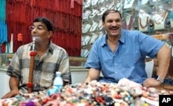 Essam Rashad, left, happily back on his sheesha pipe after a day of abstaining.