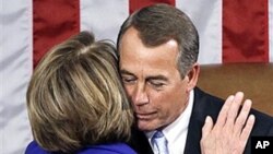 House Speaker John Boehner (r) hugs outgoing House Speaker Nancy Pelosi after receiving the gavel during the first session of the 112th Congress, on Capitol Hill in Washington, 05 Jan 2011