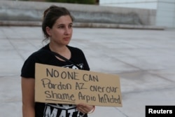 Courtnay Hough protests in Phoenix, Arizona, Aug. 25, 2017, after former Arizona sheriff Joe Arpaio was pardoned by U.S. President Trump.