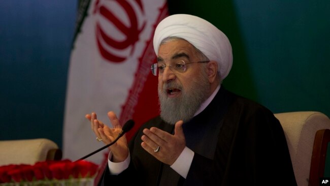 FILE - Iranian President Hassan Rouhani speaks during a meeting with Muslims leaders and scholars in Hyderabad, India, Feb. 15, 2018.