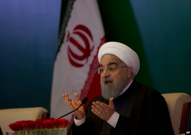 FILE - Iranian President Hassan Rouhani speaks during a meeting with Muslims leaders and scholars in Hyderabad, India, Feb. 15, 2018.