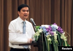 FILE - Thailand's opposition leader and former Prime Minister Abhisit Vejjajiva speaks during a news conference at a hotel in Bangkok, May 3, 2014.