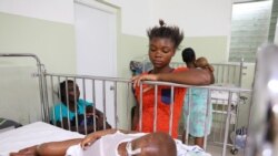 Dorvil Chiloveson, 3, swollen with edema, is watched over by his mother Linda Julien, 20, in the malnutrition ward at St. Damien Pediatric Hospital in Port-au-Prince, Haiti January 29, 2020.