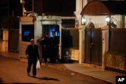 A man walks past the Saudi Arabia consul's residence, in Istanbul, Oct. 16, 2018. A high-level Turkish official says police who searched the Saudi Consulate in Istanbul found evidence that Saudi writer Jamal Khashoggi was killed there.