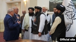 From left, Uzbek Foreign Minister Abdulaziz Kamilov and President Shavkat Mirziyoyev's Special Representative on Afghanistan Ismatulla Irgashev meet with the members of the Taliban government in Kabul, Afghanistan, Oct. 7, 2021. (mfa.uz)