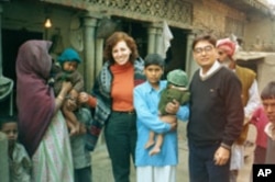 Ellyn Ogden and Dr. Baskar, WHO Surveillance Officer in Uttar Pradesh India, locate twins that were both affected by polio - a devastating blow to the family. Guidance was provided on how to care for the children to avoid deformities and where to go for a