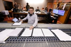 In this Oct. 21, 2019, photo, Nick Spezia works in the control room during the recording of a video game soundtrack in Nashville, Tenn.