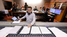 In this Oct. 21, 2019, photo, Nick Spezia works in the control room during the recording of a video game soundtrack in Nashville, Tenn.