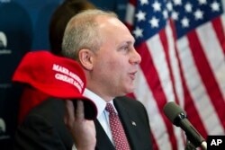 House Majority Whip Steve Scalise of Louisiana displays a "Make America Great Again" hat while speaking with reporters on Capitol Hill in Washington after a House Republican leadership meeting, Nov. 15, 2016.