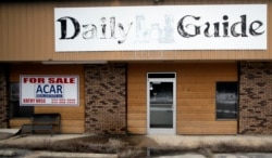 FILE - The old Daily Guide newspaper office stands for sale in St. Robert, Missouri, Feb. 19, 2019.