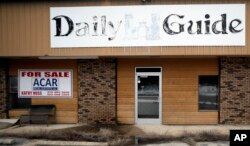 FILE - The old Daily Guide newspaper office stands for sale in St. Robert, Missouri, Feb. 19, 2019.