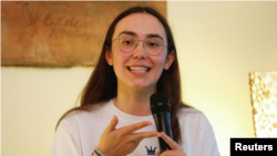 Belgian-British pilot Zara Rutherford, 19, gestures as she speaks during a conference at a Belgian ambassador's residence in Jakarta, Indonesia, December 22, 2021. (REUTERS/Ajeng Dinar Ulfiana)