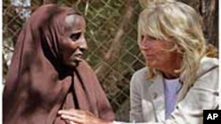 FILE - Jill Biden, wife of U.S. Vice President Joe Biden, center, sits with Somali refugees at a UNHCR screening center on the outskirts of Ifo camp outside Dadaab, eastern Kenya, 100 kms (60 miles) from the Somali border, Aug. 8, 2011.