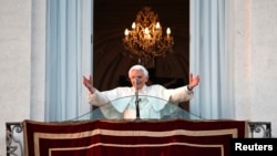 Pope Benedict waves to the faithful from the balcony of his summer residence in Castel Gandolfo, Feb. 28, 2013. 