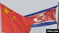 North Korea China flags