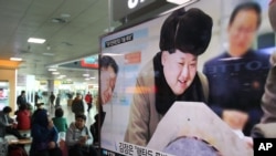 A TV screen shows North Korean leader Kim Jong Un during a news program at Seoul Railway Station in Seoul, South Korea, March 15, 2016 — the same day state media in Seoul said Kim had warned of impending tests of a nuclear warhead and ballistic missiles.