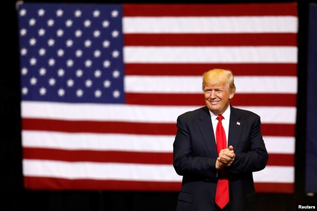 FILE - U.S. President Donald Trump takes the stage for a rally at the U.S. Cellular Center in Cedar Rapids, Iowa, U.S.