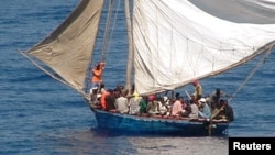 FILE - A boat overcrowded with Haitian migrants is seen off the coast of Florida.