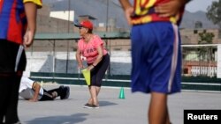 Maria Angelica Ramos, a 92 year-old soccer coach known as 'La Vieja' or 'the Old Lady,' attends a training session with her soccer team at Los Olivos, Lima, Peru, March 2, 2018.