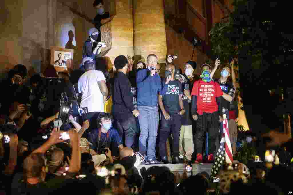 Portland Mayor Ted Wheeler speaks to Black Lives Matter protesters, July 22, 2020, in Portland, Oregon. Wheeler was hit with chemical irritants several times by federal officers dispersing demonstrators.