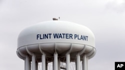 File - The Flint, Mich.,water tower is seen in this Feb. 5, 2016 photo. 