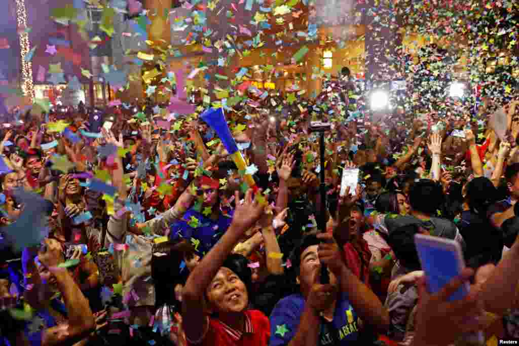 People celebrate New Year at Eastwood mall in Quezon City Metro Manila in the Philippines.