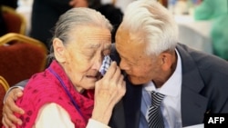 FILE - South Korean Kwon O-Hui (L) cries with her North Korean relative Ri Han-Sik (R) as they bid farewell following their three-day family reunion meeting at the Mount Kumgang resort on the North's southeastern coast, Oct. 22, 2015.