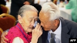 FILE - South Korean Kwon O-Hui, left, cries with her North Korean relative Ri Han-Sik as they bid farewell following their three-day family reunion at the Mount Kumgang resort on the North's southeastern coast, Oct. 22, 2015.