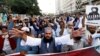 Supporters of the banned Islamist political party Tehreek-e-Labbaik Pakistan chant slogans demanding the release of their leader and the expulsion of the French ambassador over cartoons depicting the Prophet Mohammed, during a protest in Karachi, Pakistan, Oct. 29, 2021. 