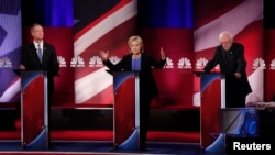 FILE - From left, Democratic U.S. presidential candidates former Maryland Gov. Martin O'Malley, former Secretary of State Hillary Clinton and Senator Bernie Sanders of Vermont participate in a debate in Charleston, S.C., Jan. 17, 2016.