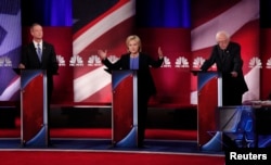 From left, Democratic U.S. presidential candidates former Maryland Gov. Martin O'Malley, former Secretary of State Hillary Clinton and Senator Bernie Sanders of Vermont participate in a debate in Charleston, S.C., Jan. 17, 2016.