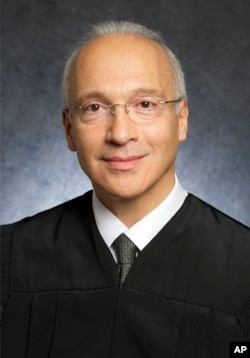 FILE - This undated photo provided by the U.S. District Court shows Judge Gonzalo Curiel.