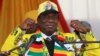 President Emmerson Mnangagwa greets supporters of his ruling ZANU PF party gather for an election rally in Chinhoyi, Zimbabwe, July 17, 2018. 