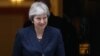 May Proceeds With Brexit Plan After High-Profile Resignations