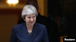 La Première ministre britannique Theresa May sortant du 10 Downing Street à Westminster, Londres, Grande-Bretagne, le 9 juillet 2018.