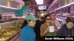 Shoppers at a food store in New York City's Manhattan Chinatown