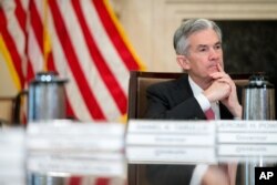 FILE - Gov. Jerome Powell attends a Board of Governors meeting at the Marriner S. Eccles Federal Reserve Board Building in Washington, Nov. 30, 2015. Powell appears to be President Donald Trump's frontrunner among candidates to replace current Fed chief Janet Yellen.