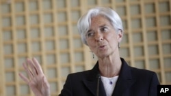 French Finance Minister Christine Lagarde gestures during a press conference, in Paris, May 25, 2011