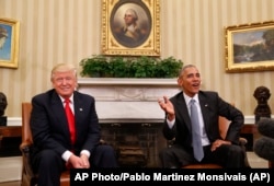 FILE - President Barack Obama meets with President-elect Donald Trump in the Oval Office of the White House in Washington, Nov. 10, 2016.