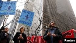 Demonstrators protest against the Dakota Access Pipeline, outside the Mizuho Bank in New York, Feb. 1, 2017.