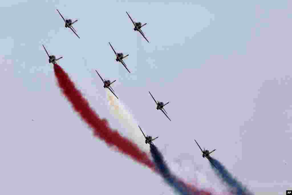 Egyptian air force planes parade during the inauguration ceremony of the new section of the Suez Canal in Ismailia, Egypt, Aug. 6, 2015.