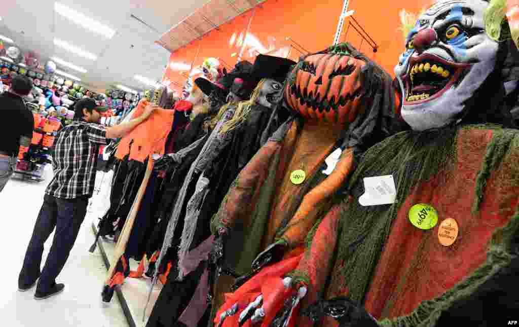 A man checks out the display at a store selling Halloween merchandise in Alhambra, California on October 29, 2015, two days before the annual celebration of Halloween on October 31. 