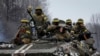 Members of the Ukrainian armed forces in armoured personnel carrier near Debaltseve, eastern Ukraine, Feb. 10, 2015.