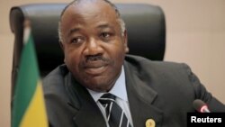 FILE - Gabon's President Ali Bongo Ondimba addresses a meeting on climate change at the 30th Ordinary Session of the Assembly of the Heads of State and the Government of the African Union in Addis Ababa, Ethiopia, Jan. 29, 2018.