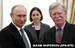 RUSSIA -- Russian President Vladimir Putin (Left) meets with U.S. national security adviser John Bolton (Right) in the Kremlin Moscow, Russia, 23 October 2018