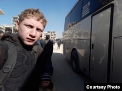Muhammed Najem takes a selfie before evacuating from Eastern Ghouta to Idlib, March 26, 2018.