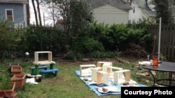 This is Marcie LeFevre's backyard and the parts to her beehives before she built them. (Image courtesy of Marcie LeFevre)